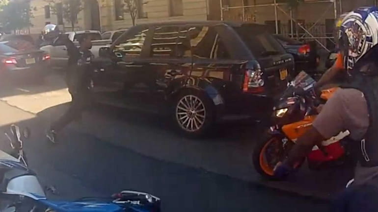 Bikers attack a Range Rover as a dispute transpires between...
