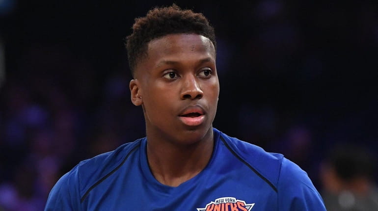 Knicks guard Frank Ntilikina looks on during warmups against the...
