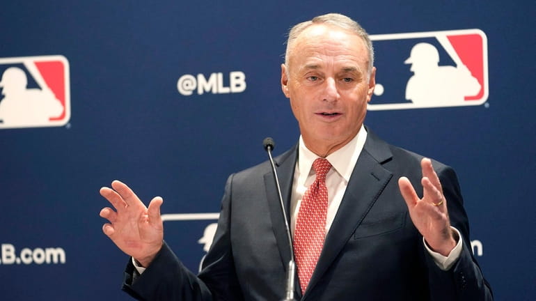 Major League Baseball commissioner Rob Manfred responds to a question...