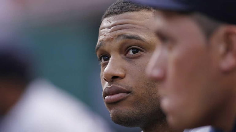 Robinson Cano #24 of the New York Yankees looks on...