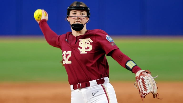 Florida State's Kathryn Sandercock pitches against Washington during the seventh...