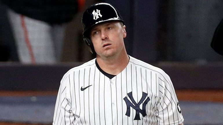 Jay Bruce of the Yankees strikes out during the 10th inning...