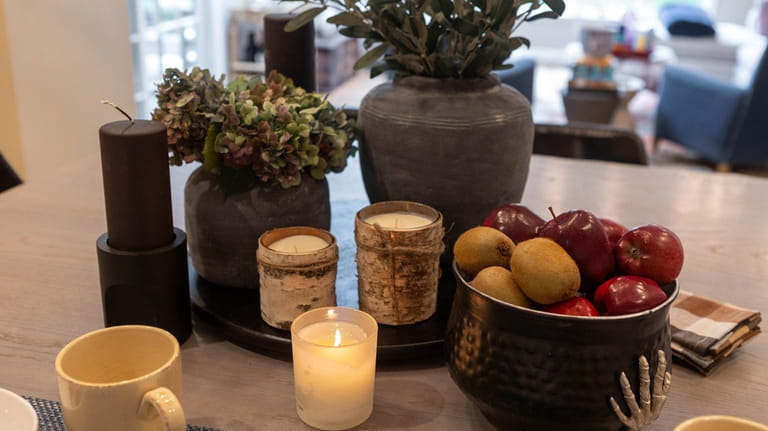 Olive branches, dried hydrangeas and candles on the kitchen island...