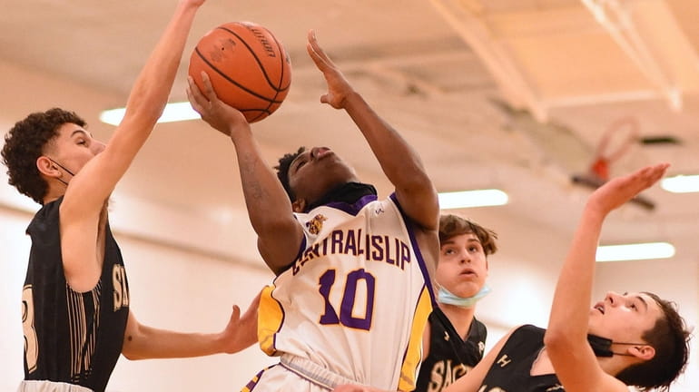 Rahleek Murray #10 of Central Islip drives to the net...