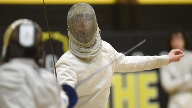 Nathan Robins of Newfield/Miller Place competes in sabre bout in...