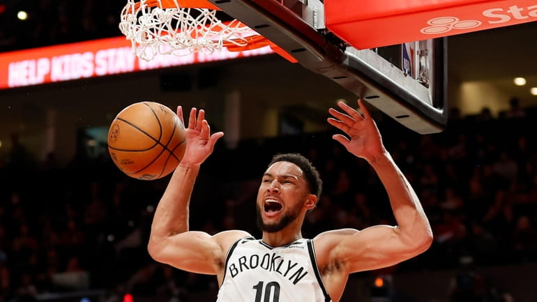 Ben Simmons #10 of the Brooklyn Nets dunks during the...