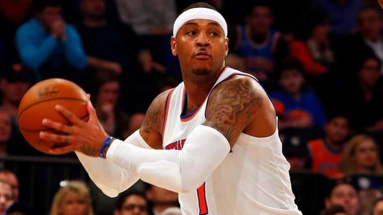 Carmelo Anthony of the New York Knicks controls the ball...
