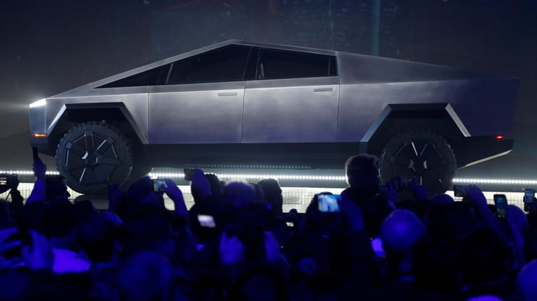 File - The Tesla Cybertruck is unveiled at Tesla's design...