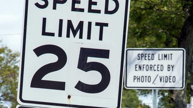 A speed limit sign is seen along Stewart Avenue in...