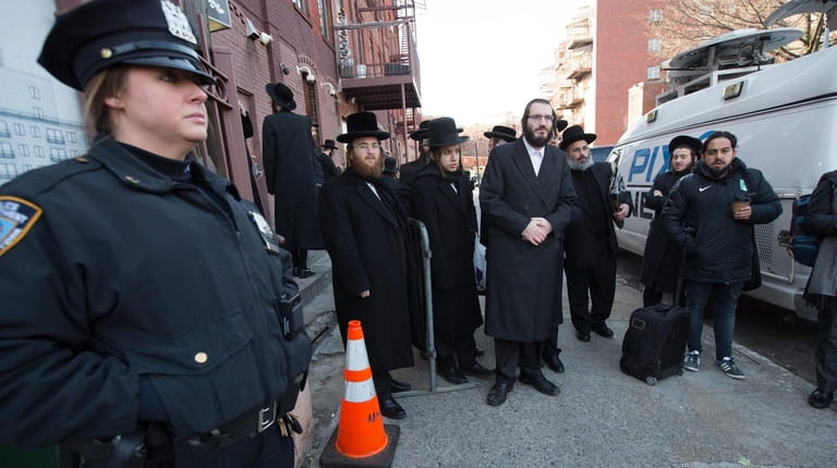The NYPD is on duty outside of the Pesach Tikvah center...