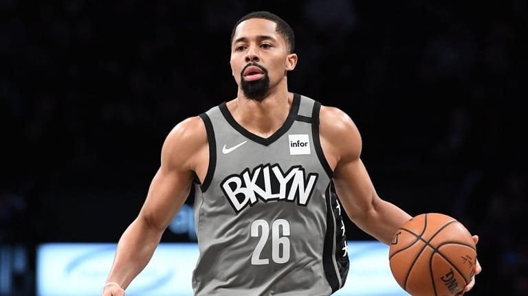 Brooklyn Nets guard Spencer Dinwiddie dribbles the ball up court...