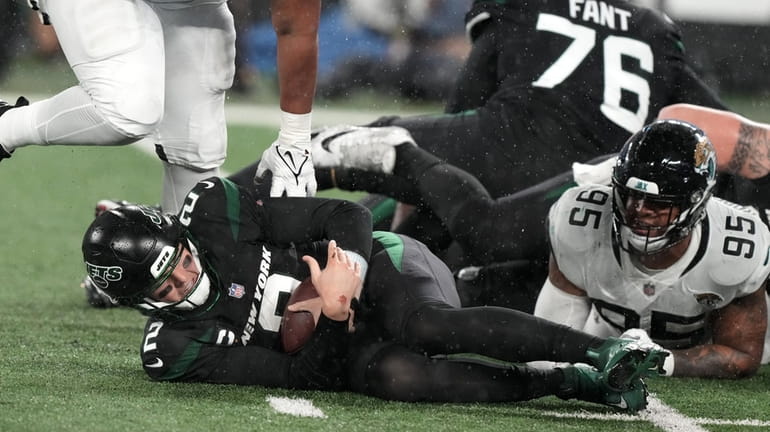 Jets QB Zach Wilson sacked during a game against the Jacksonville...
