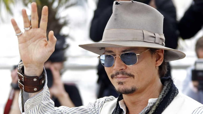 Actor Johnny Depp at a photo call for his film,...
