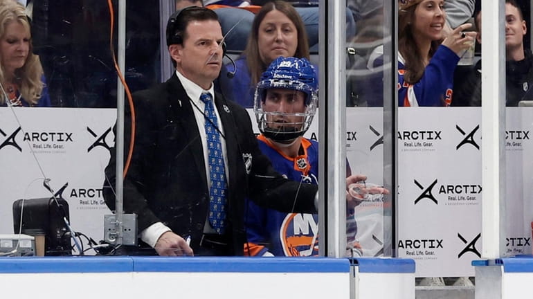 Brock Nelson of the Islanders sits in the penalty box during...
