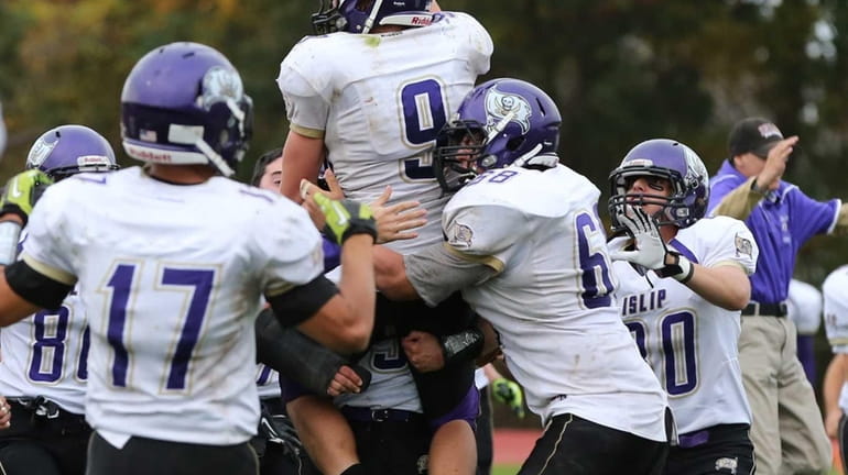 Islip's Ronnie King (no. 9) is hoisted in the air...