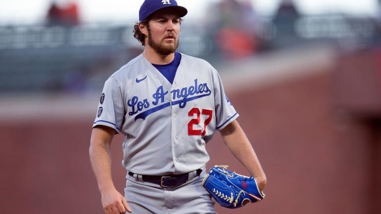 Los Angeles Dodgers starting pitcher Trevor Bauer looks toward home...