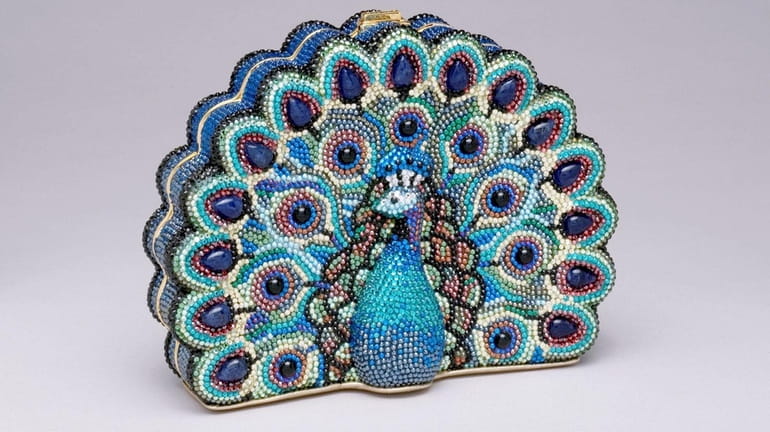 Judith Leiber's peacock-shaped rhinestone minaudière is the last handbag she...