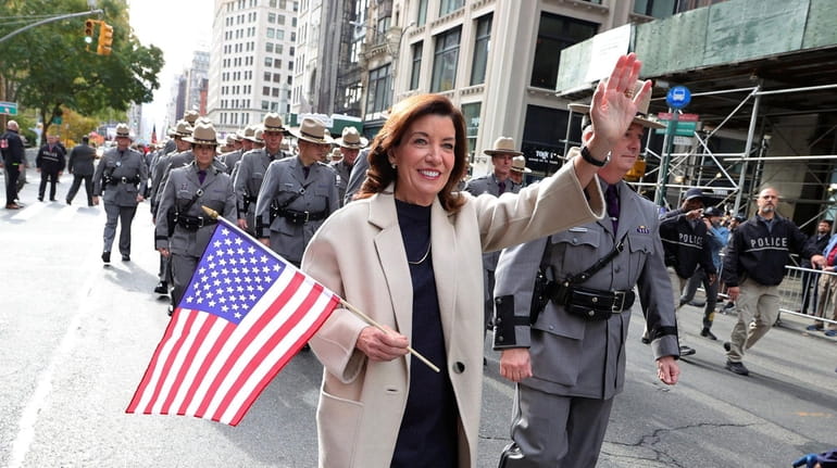 Gov. Kathy Hochul walks in the Veterans Day parade in Manhattan on Thursday. 