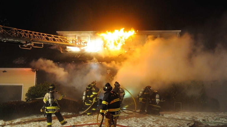 The Melville Fire Department assisted by firefighters from Dix Hills,...