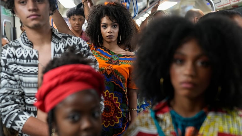 Models wear outfits designed by students from Afro-Brazilian communities at...