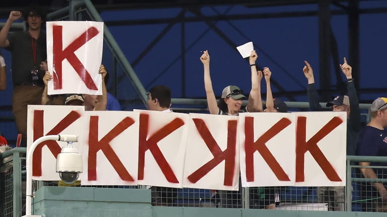 Fans mark another strikeout by Boston Red Sox starting pitcher...