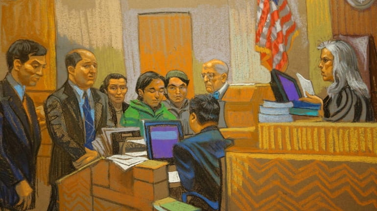 In this courtroom sketch, defendants Akhror Saidakhmetov, fourth from left,...