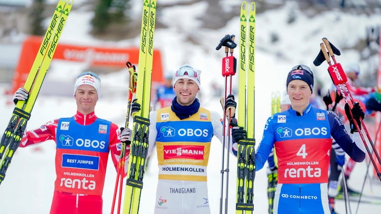 Winner Jarl Magnus Riiber of Norway, center, second placed Johannes...