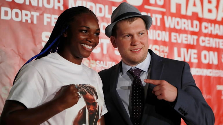 Boxer Claressa Shields stands with promotor Dmitriy Salita after a...