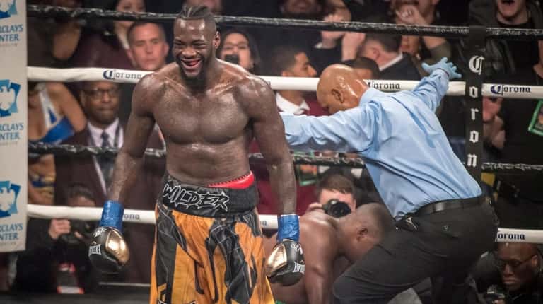 Deontay Wilder knocks out Luis Ortiz in the 10th round...