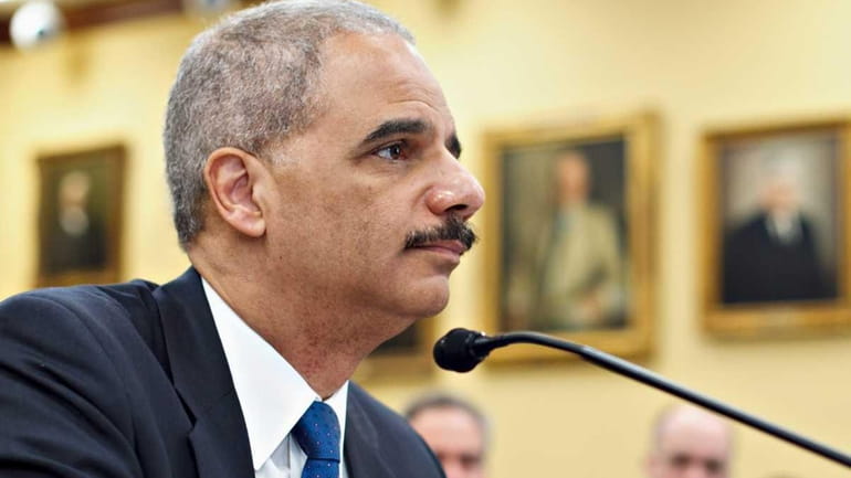 A file photo of Attorney General Eric Holder testifying on...