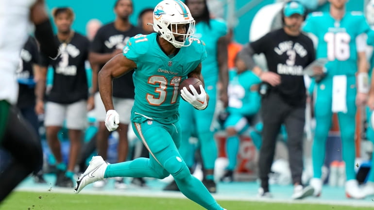 FILE -Miami Dolphins running back Raheem Mostert (31) runs during...