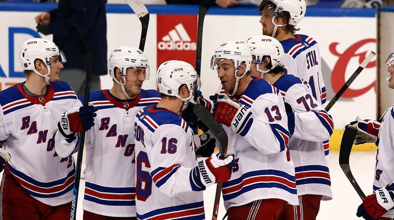 Rangers center Kevin Hayes (13) celebrates with teammates after a...