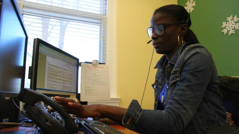 Lucie Bolden, a 311 representative, works in the call center...