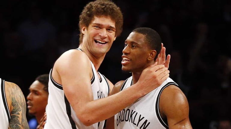 Brook Lopez, Thaddeus Young and Deron Williams of the Brooklyn...