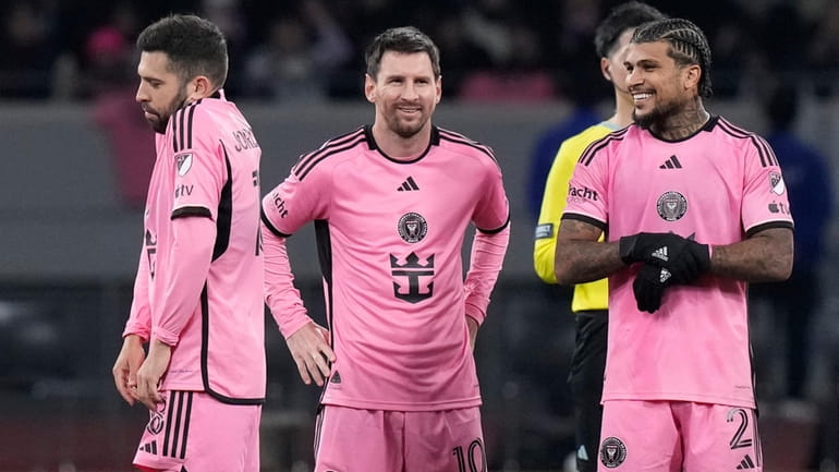 Inter Miami's Lionel Messi, center, reacts with teammates during a...