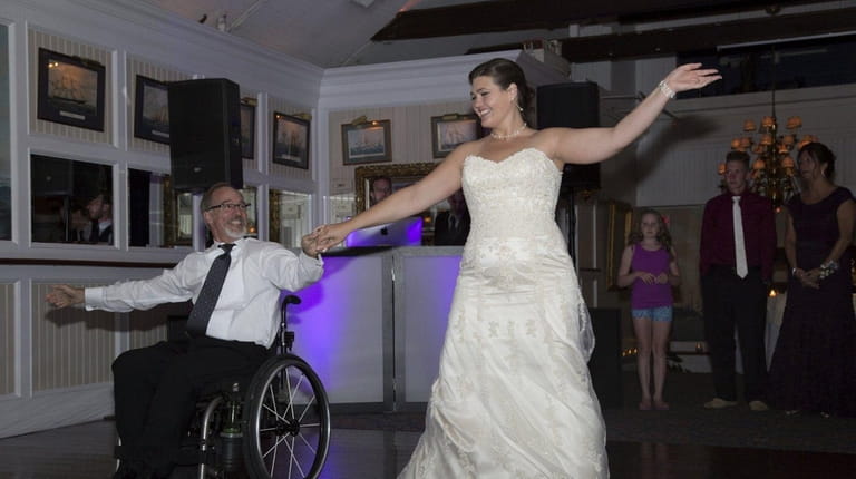 Lauren DeMarco dances with her father, John Creutzberger, during her...