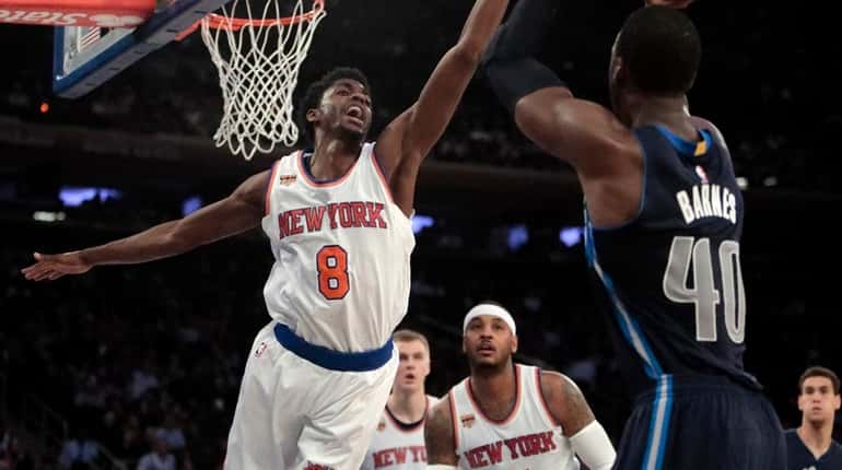 New York Knicks guard Justin Holiday (8) guards the shot...