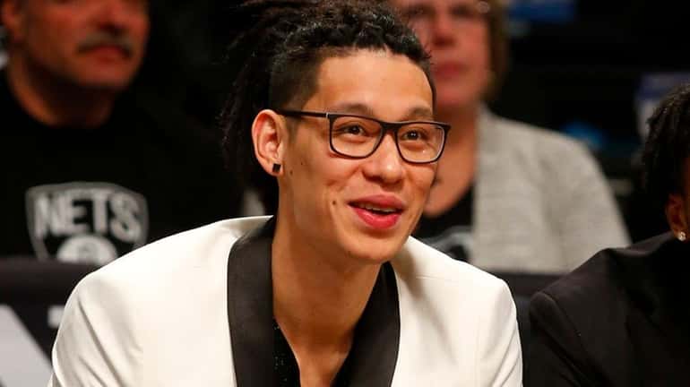 Jeremy Lin of the Nets looks on from the bench...