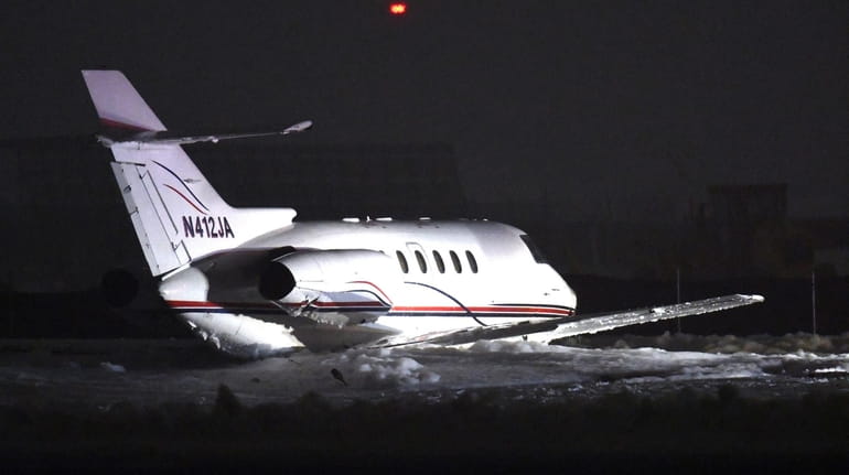 A smail jet aircraft slid off a runway at Republic Airport on...