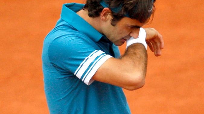 Defending champion Roger Federer lost four sets to Sweden's Robin...