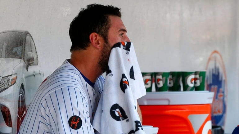 Matt Harvey of the Mets sits in the dugout after...
