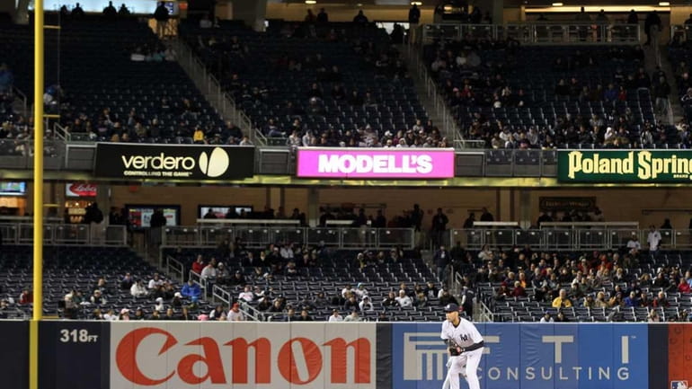 Empty seats are seen as the New York Yankees play...