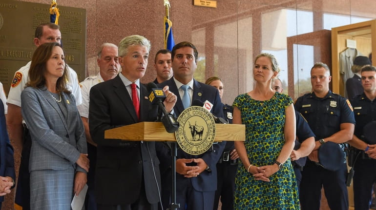 Suffolk County Executive Steve Bellone speaks Sunday in Hauppauge, joined...