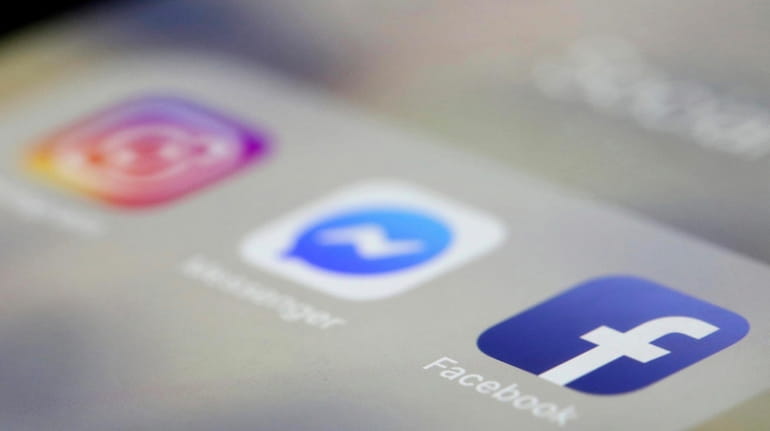 Facebook, Messenger and Instagram apps are displayed on an iPhone...