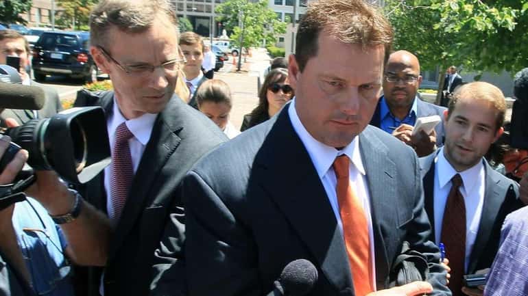 Roger Clemens leaves the U.S. District Court after the judge...