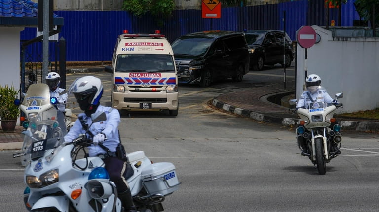 Ambulance believed to be carrying Norway's King Harald leave Sultanah...