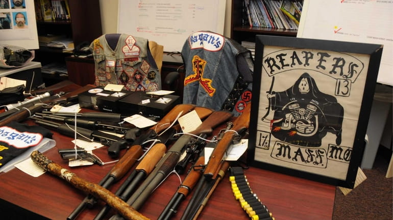 Guns and other weapons and belongings seized from The Pagan's...