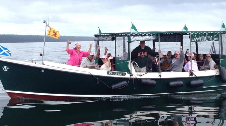 A Water to Wine boat tour travels on Cayuga Lake...