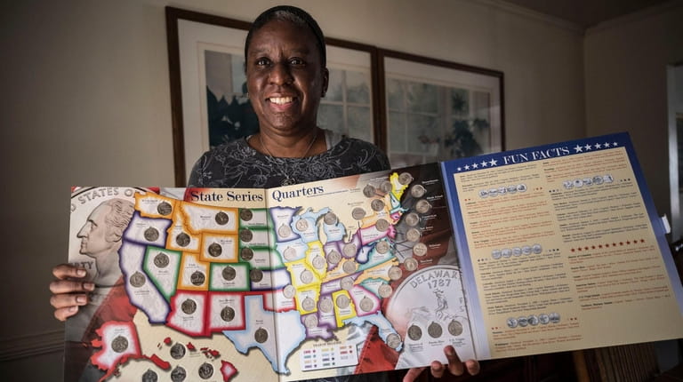 Jennifer Scott holds her state quarters collection, which got her started...