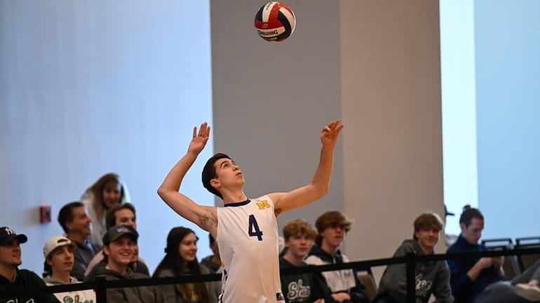 Massapequa's Zachary Russo (4) serves the ball during Division I...
